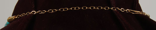 The strands are connected with a 14K gold clasp and chain.