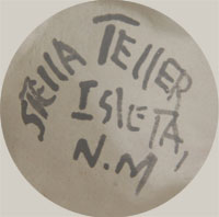 The figurine is signed Stella Teller Isleta, N.M.