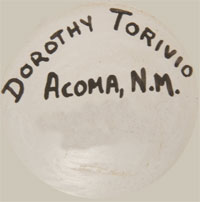 This seed jar is a visual masterpiece. It is signed with the name of the artist and pueblo on the bottom.