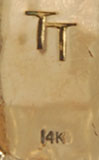 TT, the hallmark initials of Thomas (Tommy) Tso, a Navajo craftsman