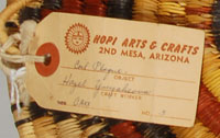 This plaque still has attached the Hopi Arts & Crafts tag with the weaver’s name.