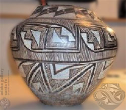 The pottery vessel that inspired this piece (shown above), came from Acoma Pueblo, ca. 1900 and is part of the Museum of Indian Arts and Culture, Museum of New Mexico, Santa Fe collection.  The glass interpretation was named Mesa Pot.  Image Source: Museum of Indian Arts and Culture website – may be subject to copyright.