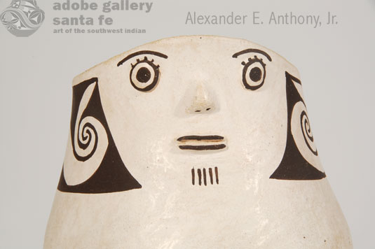 Close up view of the face of this figurine.