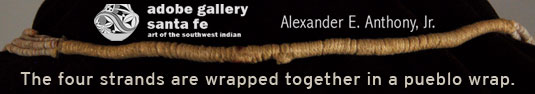 The four strands are wrapped together in a pueblo wrap.