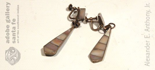The unsigned earrings are screw back. 