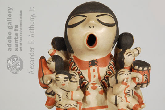 Close up view - In true Cochiti Pueblo tradition, Dorothy made her figurine with eyes closed and mouth open. The closed eyes represent “thought” and the open mouth represents “storytelling.” 