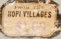 There is a paper label that states “From the Hopi Villages” on the lower portion of the jar.