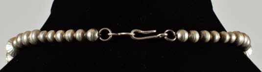 Simple hook mechanism secures the necklace. Simple hook mechanism secures the necklace.