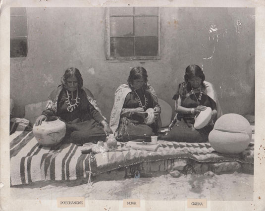 As Dr. Ed Wade has frequently stated, there were many Hopi-Tewa potters working at the same time as Nampeyo.  Evidence of this is illustrated in this rare photograph of three potters staged by an unknown photographer at an unknown date.  The potters are identified as Potchangwe, Nuva, and Gweka.  We are appreciative to Hopi-Tewa potter, Mark Tahbo, for sharing this photograph with us.  The photograph was recently found in a burned out home at First Mesa.