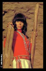 Helen Hardin (1943-1984) Tsa-Sah-Wee-Eh, Little Standing Spruce, Santa Clara Pueblo, was perhaps one of the most fascinating, complex, and engaging figures in the American Indian art world in the twentieth century. Her art was one of definitive struggle; to capture, hold, and relish those aspects of her native heritage yet depart from the Santa Fe/Dorothy Dunn School of her predecessors, including her mother Pablita Velarde.    Hardin's style, so distinctive and compelling, began to emerge in the 1970s with a series of Katsina figure paintings. These and later works are immensely complex works of such depth, energy, and gorgeous, compelling surfaces. Her personal explorations led her into the deeply affective works of the Woman Series, such as "Changing Woman." Her work is concerned with the intellectual and physical struggle of her very existence, the struggle of woman versus man, patron versus artist, Indian versus Anglo, tradition versus progression, an art of complexity and timeless beauty, a forward looking art yet rooted firmly in the ancient past.   A truly intriguing woman and indeed one of the preeminent American Indian painters of the twentieth century, lost long before her time, dying of cancer in 1984.